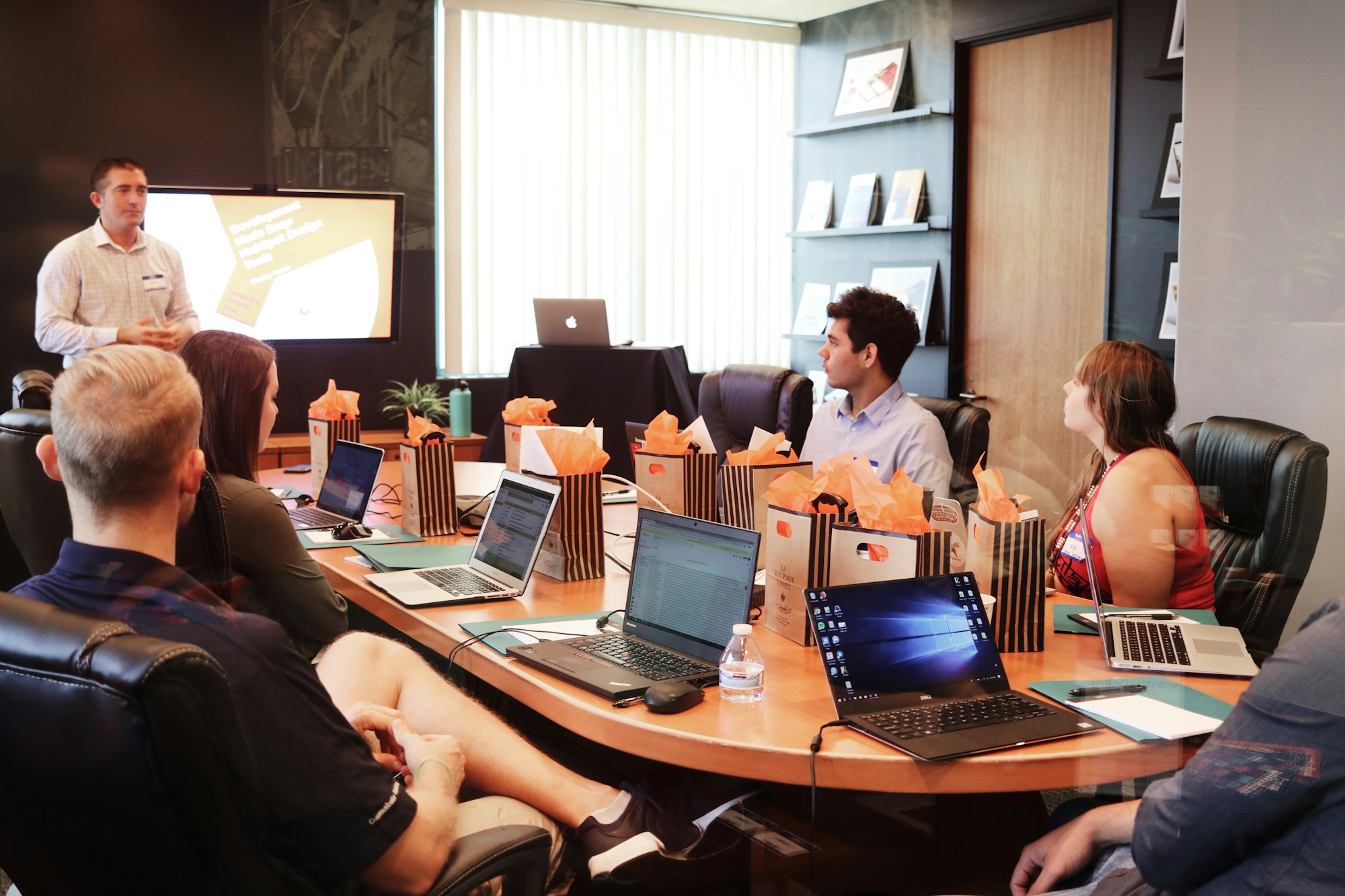 People planning around a meeting table